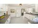 Updated kitchen with white cabinetry, modern appliances, and a stylish patterned floor at 1601 South Point Rd, Belmont, NC 28012