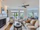 Cozy living room with fireplace, built-in shelving, and sliding doors to the patio at 16212 Walcot Ln, Cornelius, NC 28031