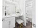 Bright bathroom with a vanity, stool, and a separate shower and toilet area at 1720 Coral Bark Ln # Kh15, Charlotte, NC 28216