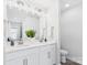 Bright bathroom with double sink vanity, modern fixtures, and ample counter space at 1720 Coral Bark Ln # Kh15, Charlotte, NC 28216