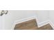 Wood-look flooring and modern white baseboards at 1720 Coral Bark Ln # Kh15, Charlotte, NC 28216