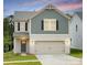 Charming two-story home featuring a brick-and-shingle exterior with a two-car garage at 1720 Coral Bark Ln # Kh15, Charlotte, NC 28216