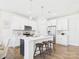 Stylish kitchen featuring white cabinets, stainless appliances, and a quartz island at 1720 Coral Bark Ln # Kh15, Charlotte, NC 28216