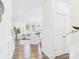 Open-concept living room with hardwood floors, recessed lighting and white furniture at 1720 Coral Bark Ln # Kh15, Charlotte, NC 28216