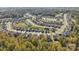 Aerial view of a residential community with lush green trees and neighborhood pool at 173 Glenn Dr, Mooresville, NC 28115