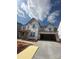Under construction home featuring an open two car garage, visible frame, and Tyvek house wrap at 173 Glenn Dr, Mooresville, NC 28115