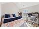 Bright bedroom featuring a vaulted ceiling, a large window, and a stylish desk area for work or study at 1811 Endeavor Ln, Clover, SC 29710