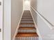 Stairway with updated treads and white risers at 1811 Endeavor Ln, Clover, SC 29710