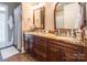 Bathroom featuring a double vanity with granite countertop and wood cabinets at 1996 Farrow Dr, Rock Hill, SC 29732