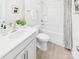 Bright bathroom with modern fixtures, white vanity, and a shower-tub combo at 2009 White Cypress Ct # Kh13, Charlotte, NC 28216