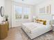 Cozy bedroom featuring a plush bed, neutral decor, and bright natural light at 2009 White Cypress Ct # Kh13, Charlotte, NC 28216