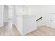A bright upstairs hallway boasting a modern light fixture, and stylish wood flooring, enhancing the home's appeal at 2009 White Cypress Ct # Kh13, Charlotte, NC 28216