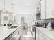 Bright modern kitchen featuring quartz countertops, stainless appliances, and an open dining area at 2009 White Cypress Ct # Kh13, Charlotte, NC 28216