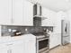 Modern kitchen with stainless steel appliances, sleek cabinets, and stylish backsplash at 2009 White Cypress Ct # Kh13, Charlotte, NC 28216