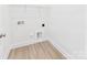 Laundry closet with washer hook-ups and wire shelving for storage at 2009 White Cypress Ct # Kh13, Charlotte, NC 28216