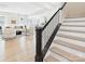 An open-concept living space featuring a staircase, seamlessly blending modern design with comfortable living at 2009 White Cypress Ct # Kh13, Charlotte, NC 28216