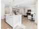Sunlit open-concept living area with hardwood floors and modern furnishings at 2009 White Cypress Ct # Kh13, Charlotte, NC 28216