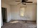 Bedroom featuring a ceiling fan and window with blinds at 2040 S Marietta St, Gastonia, NC 28054