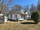 Quaint home with an enclosed porch, modest yard, and weathered exterior needing some TLC at 2040 S Marietta St, Gastonia, NC 28054