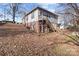 View of the backyard featuring an upper deck with stairs down at 208 W Lafayette St, Salisbury, NC 28144