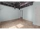 An expansive room in the basement, featuring wood plank floors at 208 W Lafayette St, Salisbury, NC 28144