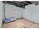 Basement area with exposed brick and a package of Krafts Faced insulation at 208 W Lafayette St, Salisbury, NC 28144
