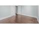 Bedroom featuring hardwood floors, fresh paint and natural light from the windows at 208 W Lafayette St, Salisbury, NC 28144
