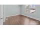 Bright bedroom with hardwood floors and large windows, offering ample natural light and comfort at 208 W Lafayette St, Salisbury, NC 28144
