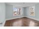 Bedroom with hardwood floors and windows offering a view of the outdoors at 208 W Lafayette St, Salisbury, NC 28144
