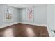 Bright bedroom featuring hardwood floors and two large windows at 208 W Lafayette St, Salisbury, NC 28144