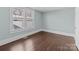 A bedroom featuring natural light, and hardwood floors with a fresh coat of paint at 208 W Lafayette St, Salisbury, NC 28144