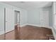 Spacious bedroom with hardwood floors, plenty of natural light, and access to another room at 208 W Lafayette St, Salisbury, NC 28144