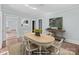 Dining room with a round wooden table, decor, and neutral walls at 208 W Lafayette St, Salisbury, NC 28144