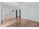 An interior room with hardwood floors and a doorway leading into another room at 208 W Lafayette St, Salisbury, NC 28144