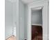 An interior room with a door leading into another room with wood floors at 208 W Lafayette St, Salisbury, NC 28144