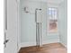 Bright room with a large window, neutral paint, and electrical panel at 208 W Lafayette St, Salisbury, NC 28144