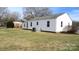 Exterior view of the backyard, showcasing the house's siding and ample green space at 216 Park Ridge Rd, Albemarle, NC 28001