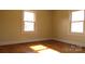 Bright bedroom with hardwood floors, showcasing natural light and a cozy atmosphere at 216 Park Ridge Rd, Albemarle, NC 28001