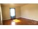 Bright bedroom with hardwood floors, showcasing natural light and a cozy atmosphere at 216 Park Ridge Rd, Albemarle, NC 28001
