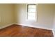 Bright bedroom showcasing hardwood floors and a window letting in ample natural light at 216 Park Ridge Rd, Albemarle, NC 28001
