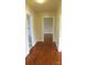 Hallway with hardwood floors connecting various rooms, offering a glimpse into a home's layout at 216 Park Ridge Rd, Albemarle, NC 28001