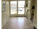 Bright sunroom with tile floors and multiple windows, providing natural light and street views at 216 Park Ridge Rd, Albemarle, NC 28001