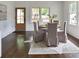 Bright dining room with hardwood floors and a modern table and chairs at 236 Victoria Ave, Charlotte, NC 28202