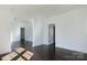 Spacious room with hardwood floors, fresh paint, and minimalist design at 236 Victoria Ave, Charlotte, NC 28202