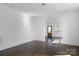 Bright living room with wood flooring and large windows at 236 Victoria Ave, Charlotte, NC 28202