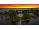 Breathtaking aerial shot of a waterfront estate with a pool, lush greenery, and private dock at 2477 Peninsula Shores Ct, Denver, NC 28037