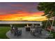 Cozy outdoor seating area with a fire pit, ideal for enjoying lake views and peaceful evenings at 2477 Peninsula Shores Ct, Denver, NC 28037