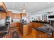 Well-appointed kitchen with stainless steel appliances, granite counters, and a center island at 2477 Peninsula Shores Ct, Denver, NC 28037