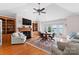 Inviting living room featuring a fireplace, built-in shelving, and lake views at 2477 Peninsula Shores Ct, Denver, NC 28037