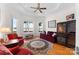 Elegant living room with lake views, wine storage, and comfortable seating area at 2477 Peninsula Shores Ct, Denver, NC 28037
